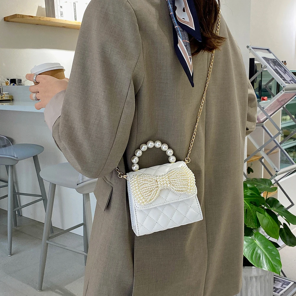 2021 Ladies Bag Fashion Casual Messenger Bag Lattice Chain Pearl Bag Shoulder Bag Pure Color PU Handbag Mobile Phone Bag Handbag
2021 Ladies Bag Fashion Casual Messenger Bag Lattice Chain Pearl Bag Shoulder Bag Pure Color PU Handbag Mobile Phone Bag Handbag