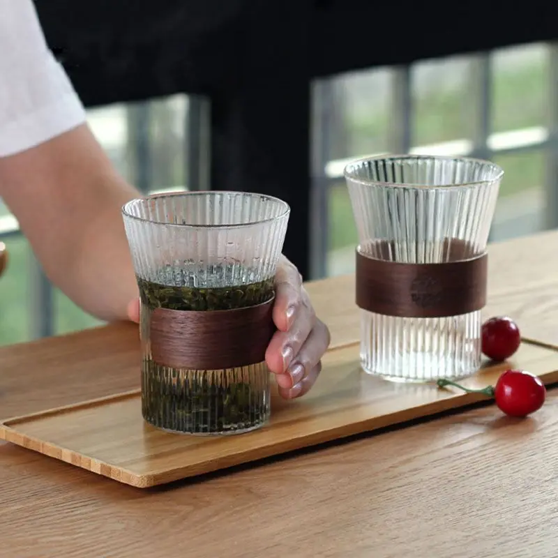 2021 High Borosilica Vertical Tea Cup Transparent Striped Glass Cup With Wooden Handle Household Kitchen Drinkware
2021 High Borosilica Vertical Tea Cup Transparent Striped Glass Cup With Wooden Handle Household Kitchen Drinkware