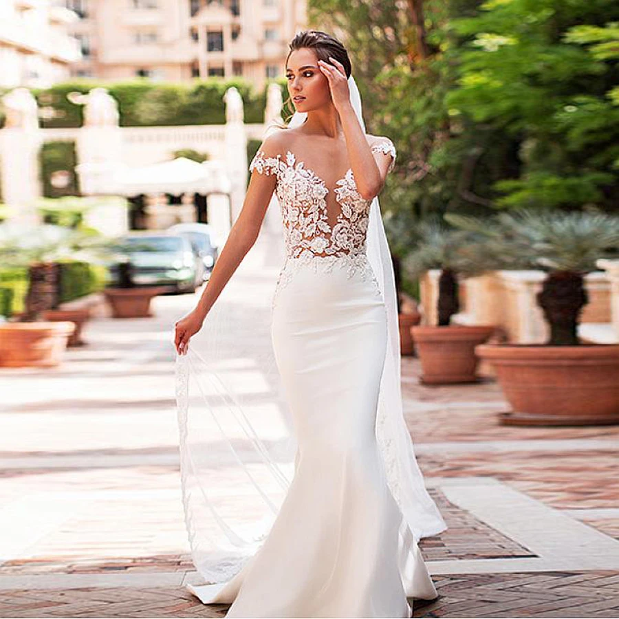 Lace Appliques Top See Through Mermaid Wedding Dresses Cap Sleeves Sweep Train Bridal Dress
Lace Appliques Top See Through Mermaid Wedding Dresses Cap Sleeves Sweep Train Bridal Dress