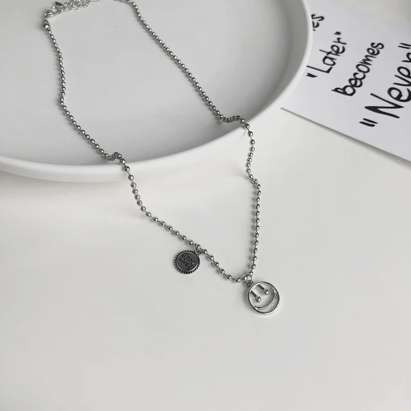 

Origin Summer Circle Geometrical Hollow Out Smile Face Pendant Necklace for Women Asymmetric Letter Round Bead Chain Necklace