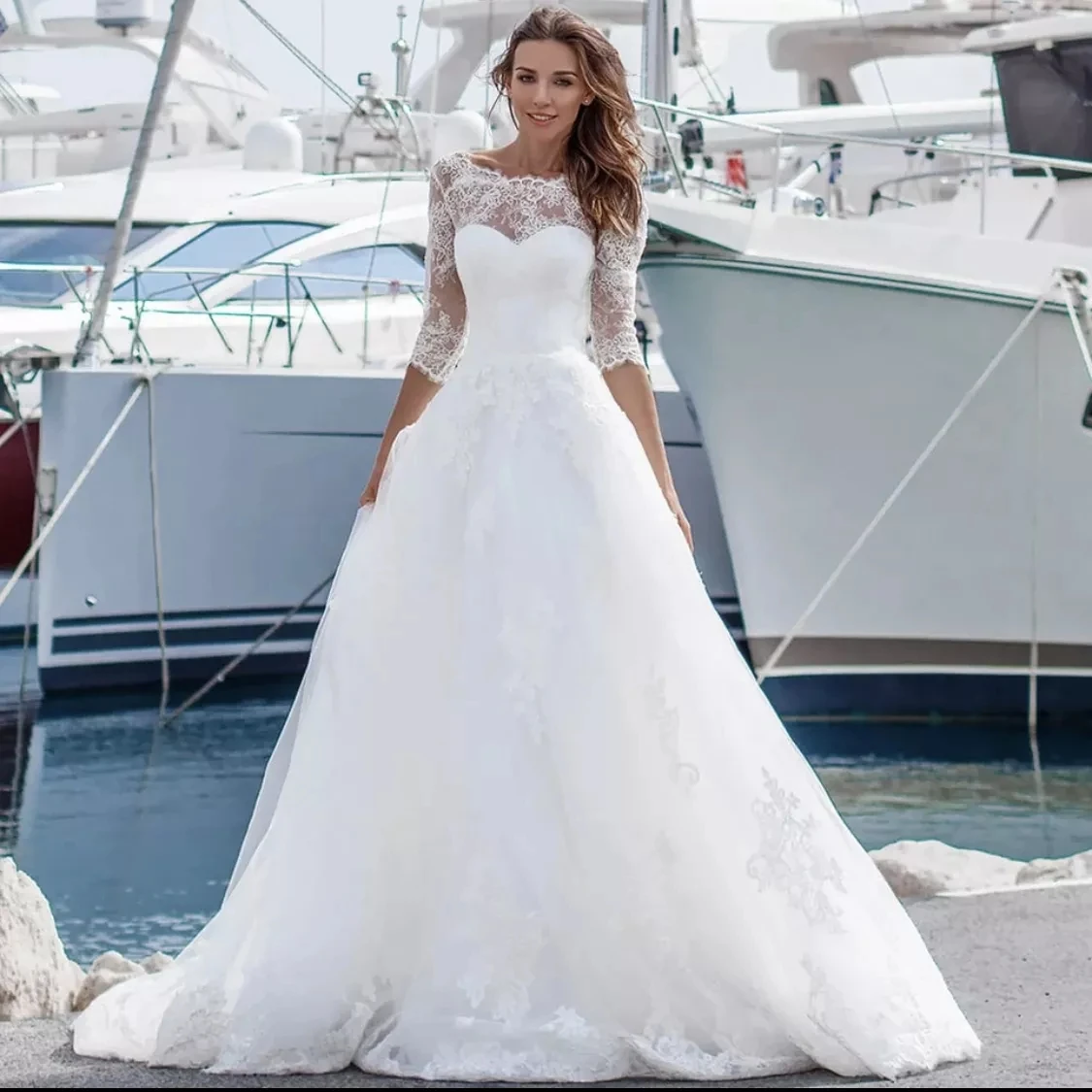 2021 A-Line O-Neck Wedding Dress Beach 3/4 Sleeve Backless Lace Appliques Sequined Sweep Train Bride Gown Vestidos De Noiva
2021 A-Line O-Neck Wedding Dress Beach 3/4 Sleeve Backless Lace Appliques Sequined Sweep Train Bride Gown Vestidos De Noiva
