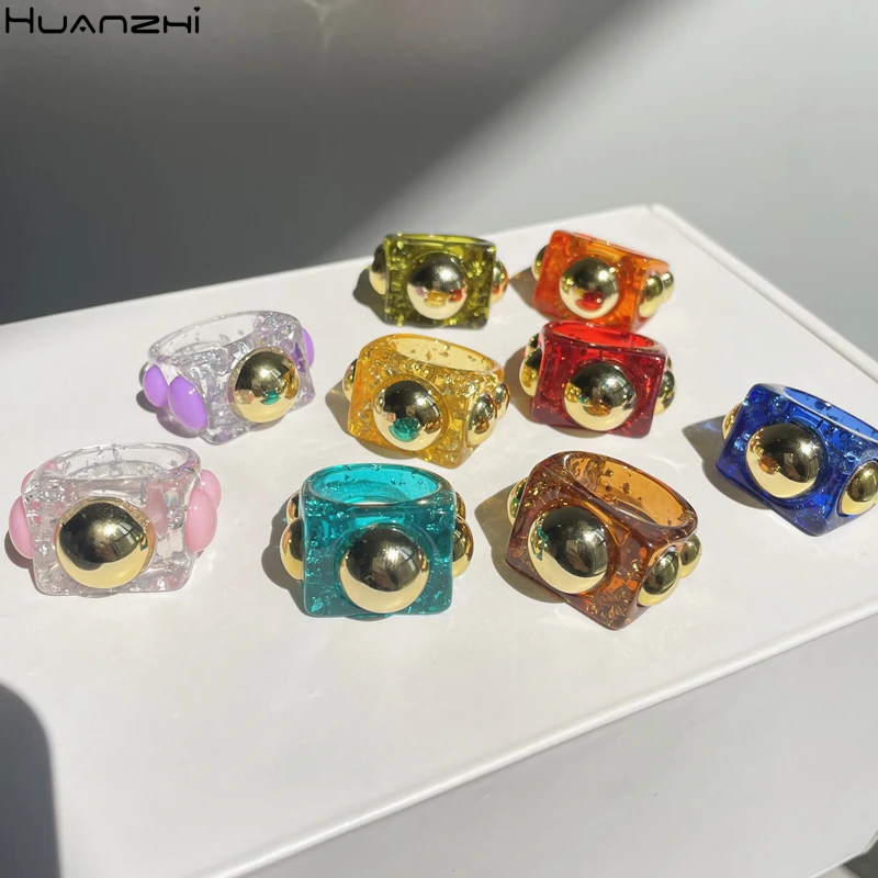 Summer New Colorful Shiny Resin Geometric Acrylic Ring Golden Metal Bead Ring Square for Women Girls Travel Jewelry HUANZHI 2021
Summer New Colorful Shiny Resin Geometric Acrylic Ring Golden Metal Bead Ring Square for Women Girls Travel Jewelry HUANZHI 2021