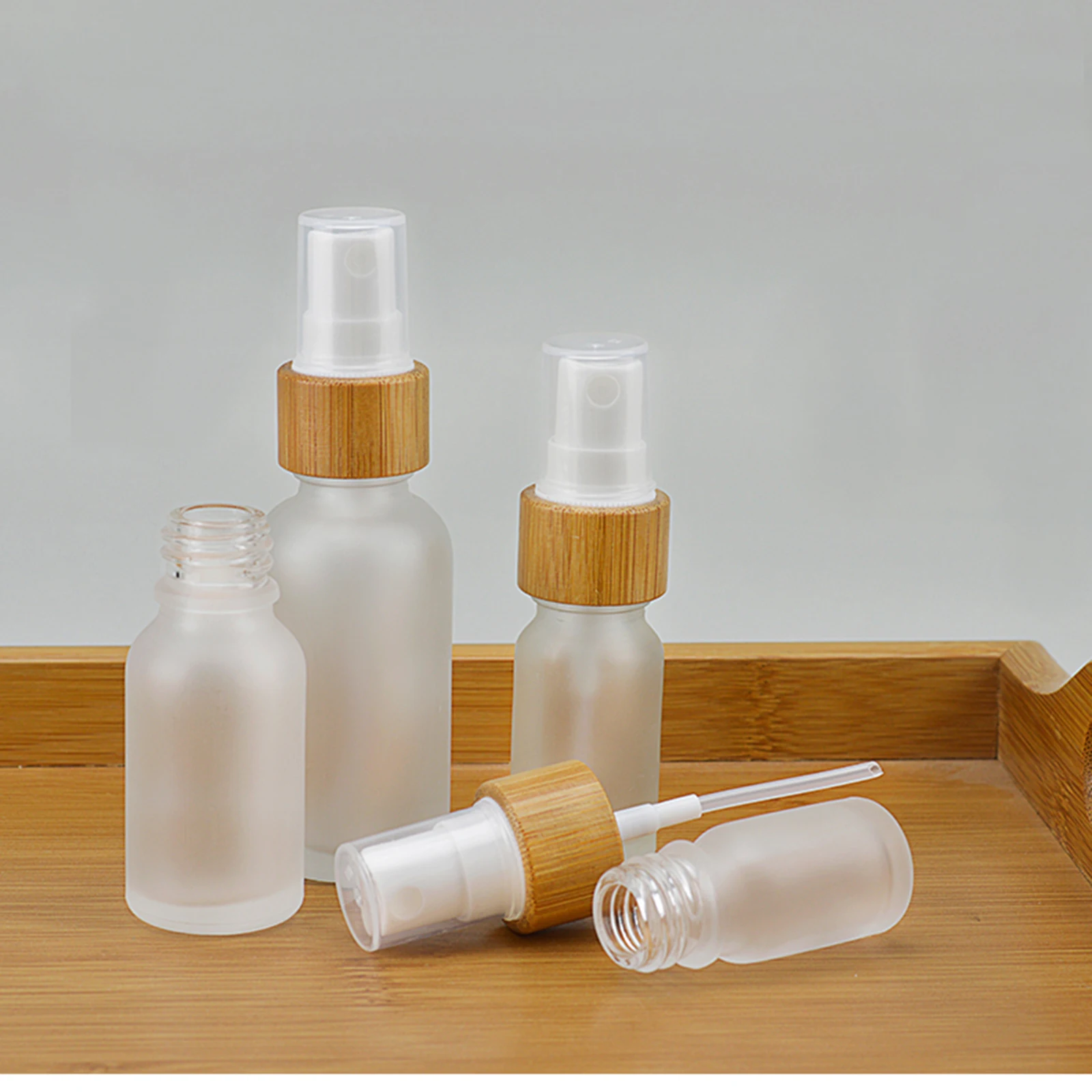 Refillable Empty Frosted Glass Spray Bottle With Natural Bamboo Lid Pump Head Travel Perfume Liquid Cosmetic Vials Containers
Refillable Empty Frosted Glass Spray Bottle With Natural Bamboo Lid Pump Head Travel Perfume Liquid Cosmetic Vials Containers