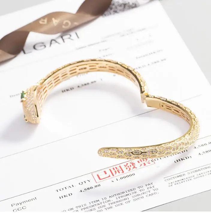 Women's big head green eye snake-shaped bracelet opening personality wide animals classic cool girls luxurious bangle jewelry
Women's big head green eye snake-shaped bracelet opening personality wide animals classic cool girls luxurious bangle jewelry