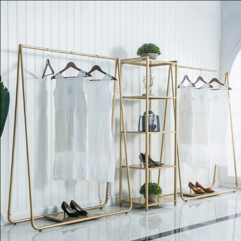 Clothing store display rack gold floor landed Frame clothing store shelves iron art island display rack clothes organizer
Clothing store display rack gold floor landed Frame clothing store shelves iron art island display rack clothes organizer