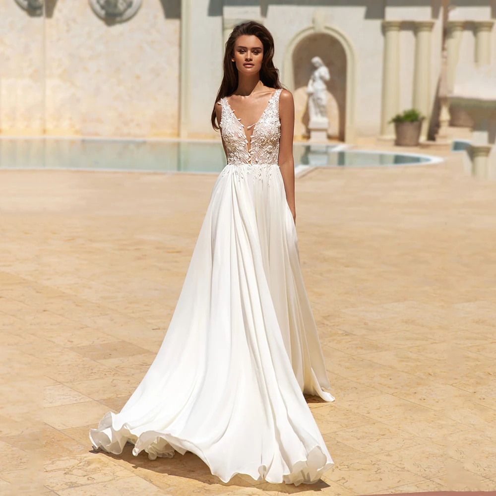 Summer Wedding Dress Sexy V Neck Sleeveless Sequin Lace Appliques Chiffon Beach Bridal Gowns Custom Plus Size
Summer Wedding Dress Sexy V Neck Sleeveless Sequin Lace Appliques Chiffon Beach Bridal Gowns Custom Plus Size