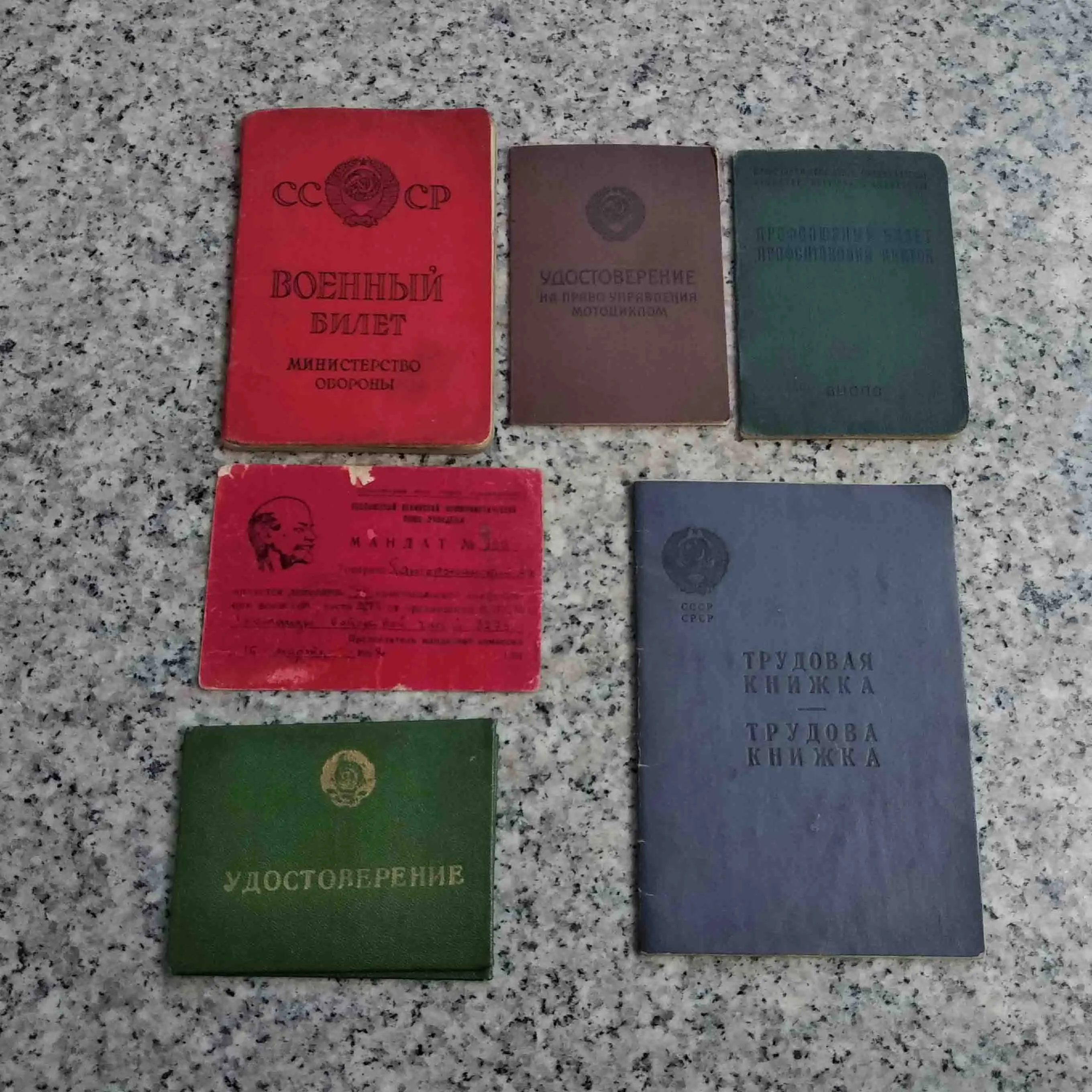 A set of Soviet Union soldier certificates, trade unions, motorcycles, labor certificates, etc. 
A set of Soviet Union soldier certificates, trade unions, motorcycles, labor certificates, etc.
