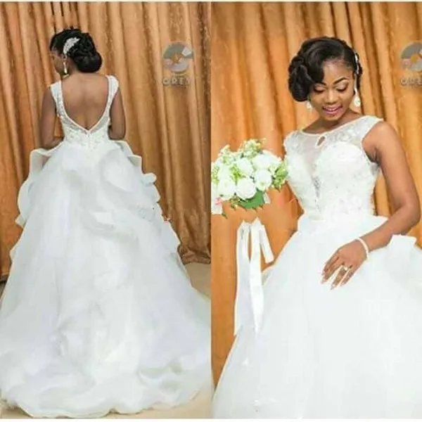 South African Wedding Dresses Lace Beads Backless Ruffle Organza Arabic Bridal Ball Gowns Vestido de novia Bride Dress 
South African Wedding Dresses Lace Beads Backless Ruffle Organza Arabic Bridal Ball Gowns Vestido de novia Bride Dress