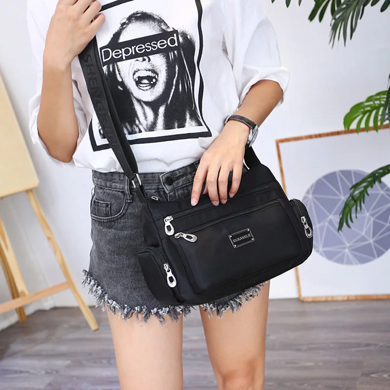 New Nylon Cloth Shoulder Messenger Bag Multi-Functional Oxford Waterproof Casual Crossbody Packet Travel Canvas Bag Bolso Mujer
New Nylon Cloth Shoulder Messenger Bag Multi-Functional Oxford Waterproof Casual Crossbody Packet Travel Canvas Bag Bolso Mujer