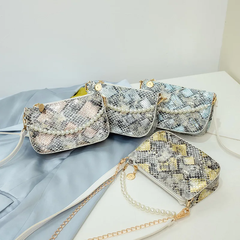 The Woman's Bag New Pearl Handbag One Shoulder Diagonal Cross-bag Fashion Chain Under The Bag Mobile Phone Bag
The Woman's Bag New Pearl Handbag One Shoulder Diagonal Cross-bag Fashion Chain Under The Bag Mobile Phone Bag