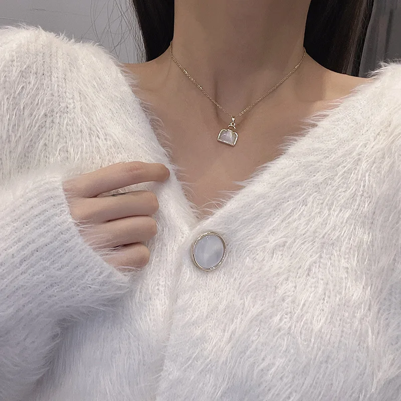 Simple fashion temperament opal bag pendant titanium steel clavicle chain light luxury temperament net red necklace female 
Simple fashion temperament opal bag pendant titanium steel clavicle chain light luxury temperament net red necklace female
