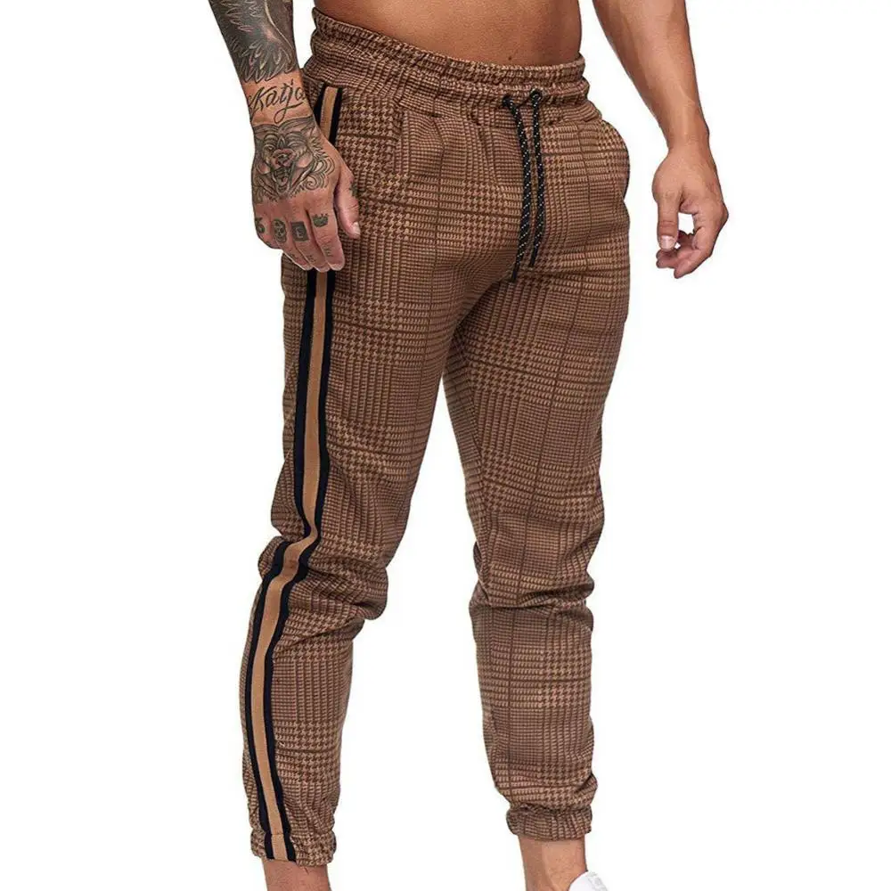 Casual Loose Pencil Pants Men Casual Pocket Stripe Plaid Print Drawstring Long Pants Ankle-Tied Trousers pantalones hombre 2021
Casual Loose Pencil Pants Men Casual Pocket Stripe Plaid Print Drawstring Long Pants Ankle-Tied Trousers pantalones hombre 2021