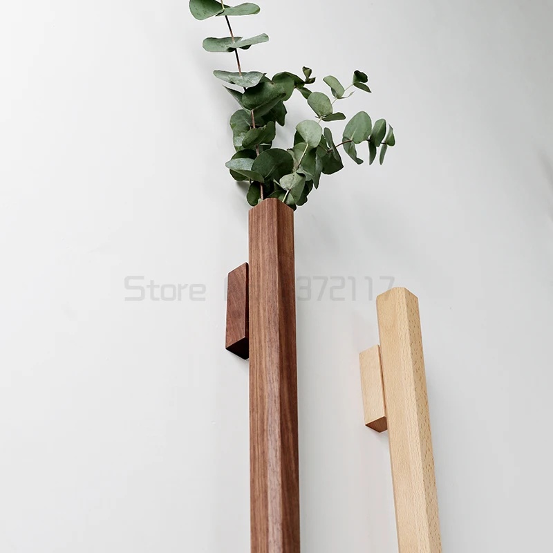 Flower arrangement vase wall hanging vase water culture vase black walnut solid wood flower arrangement wall decoration
Flower arrangement vase wall hanging vase water culture vase black walnut solid wood flower arrangement wall decoration