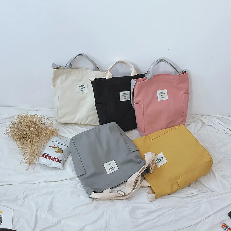 Canvas simple style fashion unisex casual handbag multifunctional shoulder bag large capacity waterproof reusable shopping bag 
Canvas simple style fashion unisex casual handbag multifunctional shoulder bag large capacity waterproof reusable shopping bag