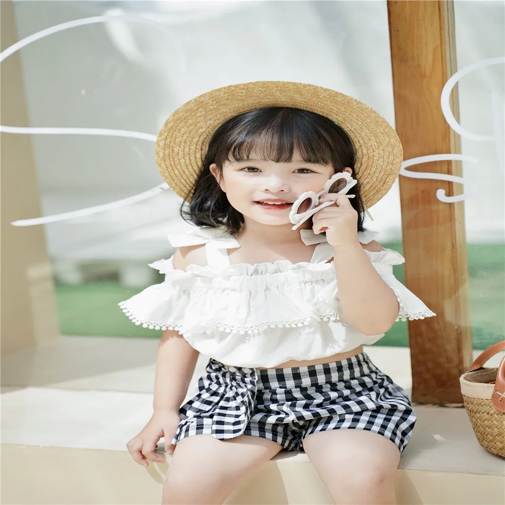 Summer 2 Pcs Baby Girls Sweet Children Sets Toddler White Lace-Up Bow Short Sleeve T-Shirt Tops + Plaid Elastic Waist Shorts
Summer 2 Pcs Baby Girls Sweet Children Sets Toddler White Lace-Up Bow Short Sleeve T-Shirt Tops + Plaid Elastic Waist Shorts