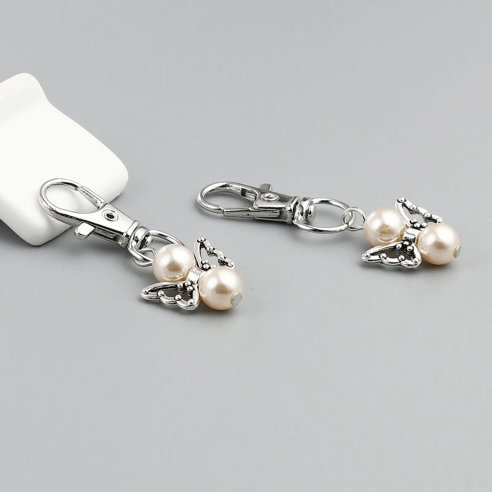 5Pcs Creative Keyring Sweet Butterfly Pearl Dangle Charms Keychain Wings Pendant Women Girls Key Rings Pendant DIY Chain Jewelry
5Pcs Creative Keyring Sweet Butterfly Pearl Dangle Charms Keychain Wings Pendant Women Girls Key Rings Pendant DIY Chain Jewelry