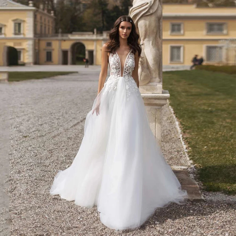Sexy Wedding Dresses Deep V Neck Sleeveless Lace Appliques Tulle Open Back A Line Court Train Bridal Gowns Robe De Mariée
Sexy Wedding Dresses Deep V Neck Sleeveless Lace Appliques Tulle Open Back A Line Court Train Bridal Gowns Robe De Mariée