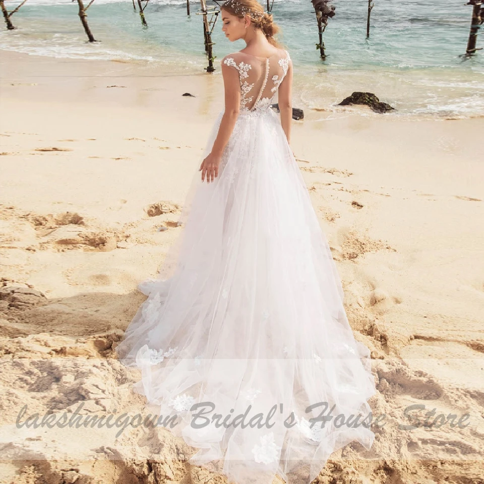 2020 Beach Wedding Dress Sexy Lace Appliques Bridal Dresses Buttons Back Boho Tulle Long Wedding Dresses Suknia Slubna
2020 Beach Wedding Dress Sexy Lace Appliques Bridal Dresses Buttons Back Boho Tulle Long Wedding Dresses Suknia Slubna