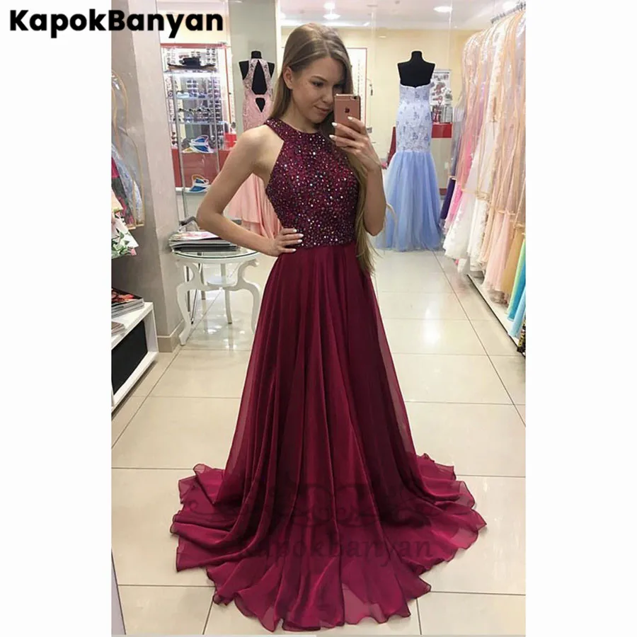 Rhinestones Halter Sleeveless Long A-line Sweep Train Prom Dresses Burgundy Long Party Gown
Rhinestones Halter Sleeveless Long A-line Sweep Train Prom Dresses Burgundy Long Party Gown