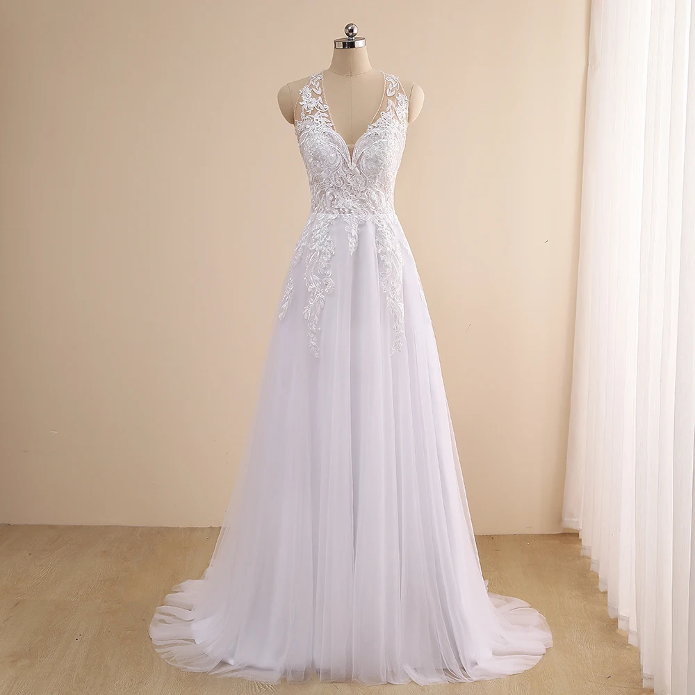 Robe De Mariee Wedding Dress 2021 Sexy Halter Sleeveless Beading Applique A Line Backless Bridal Gown Sweep Train
Robe De Mariee Wedding Dress 2021 Sexy Halter Sleeveless Beading Applique A Line Backless Bridal Gown Sweep Train