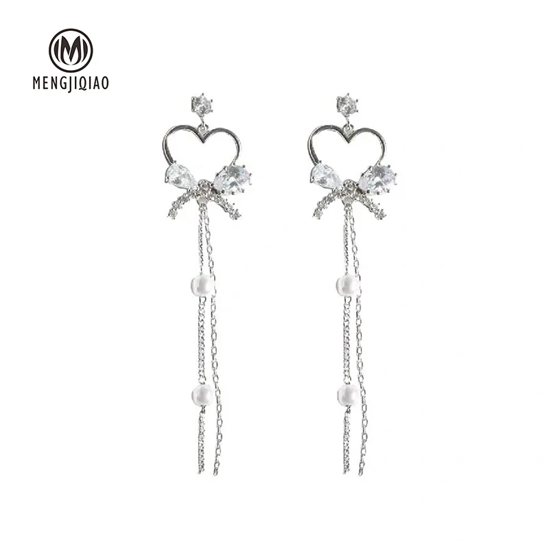 MENGJIQIAO Korean New Shiny Crystal Hollow Heart Bowknot Long Pendientes Mujer Moda Bijoux Rhinestone Pearl Earrings Brincos
MENGJIQIAO Korean New Shiny Crystal Hollow Heart Bowknot Long Pendientes Mujer Moda Bijoux Rhinestone Pearl Earrings Brincos