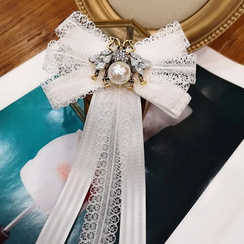 Korean Crystal Bees White Lace Bowtie Brooch Ribbon Bowkont Necktie Shirt Corsage Elegant Brooches Clothing Women Accessories
Korean Crystal Bees White Lace Bowtie Brooch Ribbon Bowkont Necktie Shirt Corsage Elegant Brooches Clothing Women Accessories