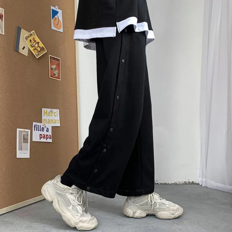 Cotton Wide-leg Pants Men's Fashion Joggers Sweatpants Men Streetwear Korean Loose Hip-hop Button Casual Pants Mens Trousers
Cotton Wide-leg Pants Men's Fashion Joggers Sweatpants Men Streetwear Korean Loose Hip-hop Button Casual Pants Mens Trousers