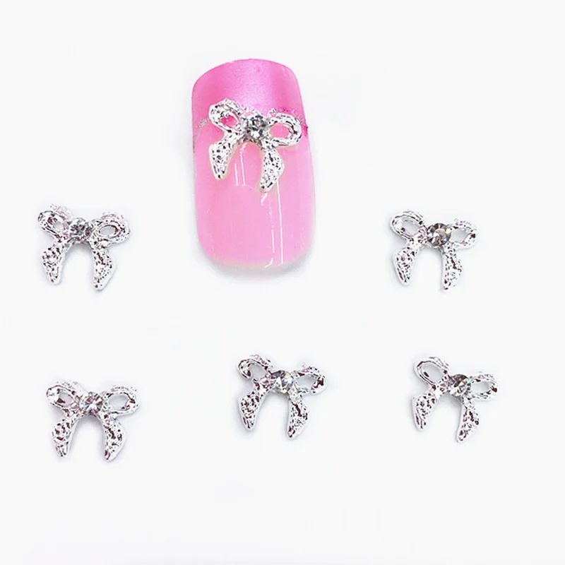 10 Pcs/bag Nail Alloy Jewelry Silver Diamond Bow Shining 3D Nail Art Decoration New Style Decoracao Acessorios Joias Flat 58
10 Pcs/bag Nail Alloy Jewelry Silver Diamond Bow Shining 3D Nail Art Decoration New Style Decoracao Acessorios Joias Flat 58