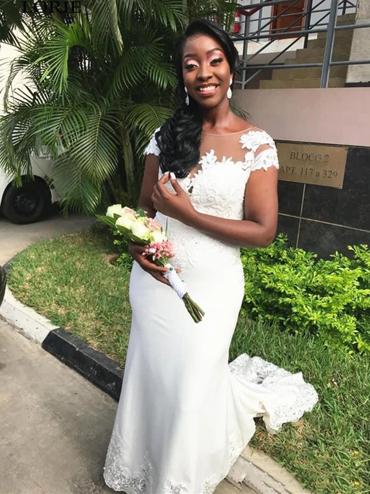 2020 African Wedding Dress Mermaid Cap Sleeve Sheer Neck Lace Floor Length vestido de noiva Bridal Gowns Spaghetti Straps
2020 African Wedding Dress Mermaid Cap Sleeve Sheer Neck Lace Floor Length vestido de noiva Bridal Gowns Spaghetti Straps