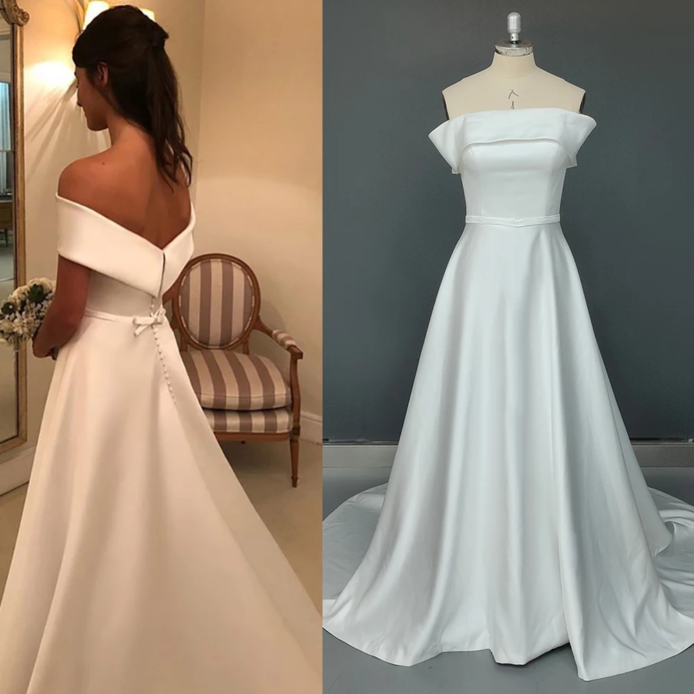 Off The Shoulder Buttons Simple Wedding Gown Low Cut Sleeveless Tieknot Custom Made Straight Across Neck Luxe Satin Bridal Dress
Off The Shoulder Buttons Simple Wedding Gown Low Cut Sleeveless Tieknot Custom Made Straight Across Neck Luxe Satin Bridal Dress