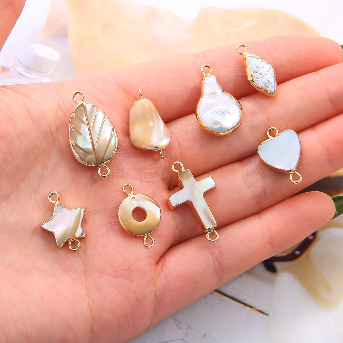 Natural Shell Five-pointed Star/Round/Cross/Heart/Leaves Shape Pendant Copper Plated Edged Hanging DIY Necklace Bracelet
Natural Shell Five-pointed Star/Round/Cross/Heart/Leaves Shape Pendant Copper Plated Edged Hanging DIY Necklace Bracelet