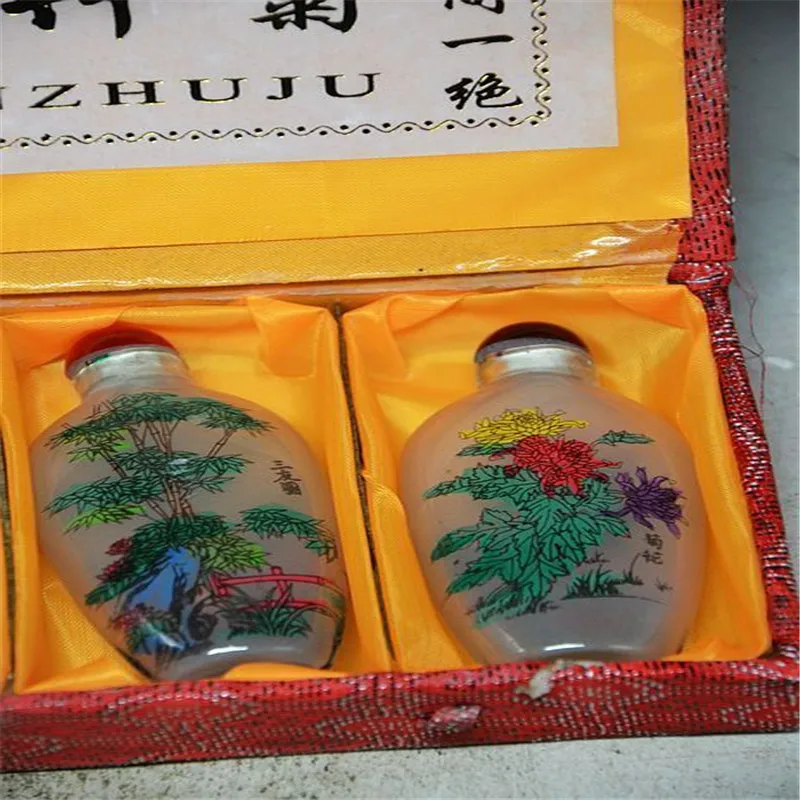 Chinese glass snuff bottle inside a hand-painted Meilan Ju Bamboo 
Chinese glass snuff bottle inside a hand-painted Meilan Ju Bamboo