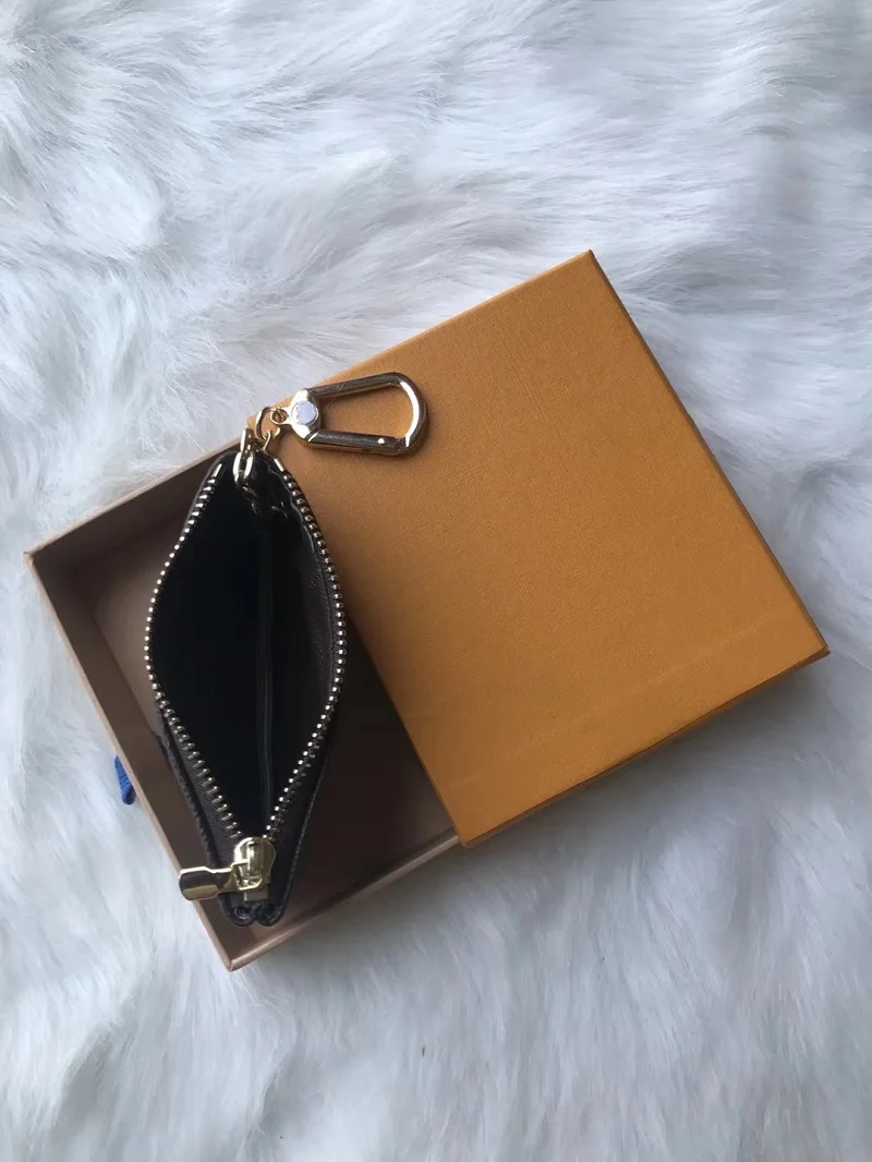 Genuine Leather Men Women Mini Coin Purse Luxury Designer Key Pouch Pochette Cles Wallet Ship with Brand Orange Box
Genuine Leather Men Women Mini Coin Purse Luxury Designer Key Pouch Pochette Cles Wallet Ship with Brand Orange Box