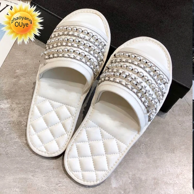 Сандалии женские из овечьей кожи, маленькие босоножки на цепочке с жемчугом, Повседневная пляжная обувь в римском стиле, лето 2022
Сандалии женские из овечьей кожи, маленькие босоножки на цепочке с жемчугом, Повседневная пляжная обувь в римском стиле, лето 2022