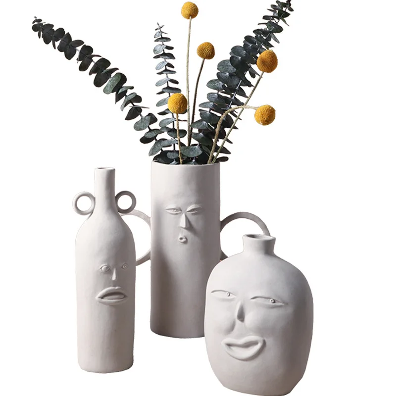 Nordic art ceramic vase decoration, abstract human face flower arranging device 
Nordic art ceramic vase decoration, abstract human face flower arranging device