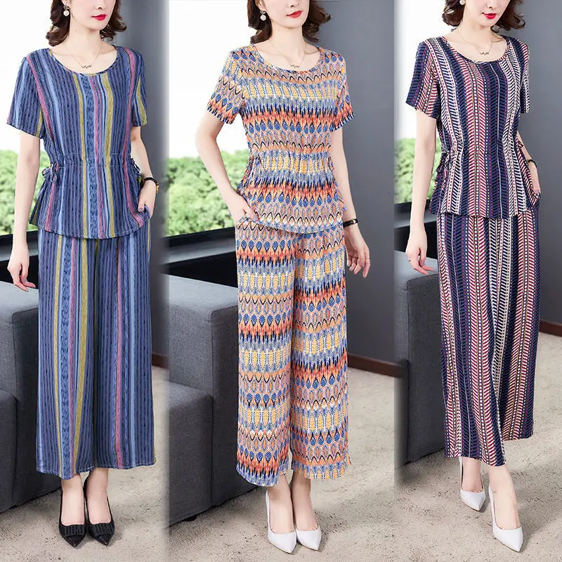 Сандалии для среднего возраста; Женские комплекты из двух предметов; Сезон лето; Повседневные свободные Цветочный принт топы и модные брюки...
Сандалии для среднего возраста; Женские комплекты из двух предметов; Сезон лето; Повседневные свободные Цветочный принт топы и модные брюки...