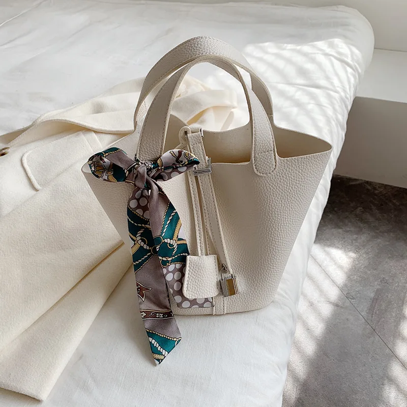 Textured PU leather ladies handbag new fairy temperament fashion portable bucket bag design ribbon decoration women's travel bag
Textured PU leather ladies handbag new fairy temperament fashion portable bucket bag design ribbon decoration women's travel bag
