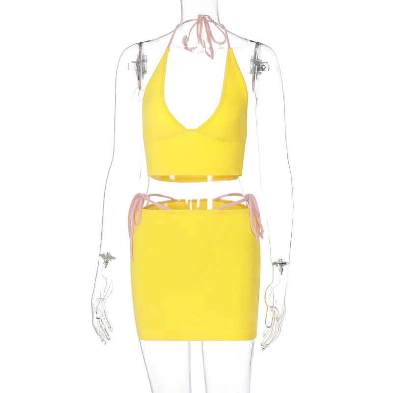 Hugcitar 2021 Sleeveless Halter Bandage Sexy Crop Top Skirt 2 Pieces Set Summer Women Fashion Hollow Out Y2K Tracksuit 
Hugcitar 2021 Sleeveless Halter Bandage Sexy Crop Top Skirt 2 Pieces Set Summer Women Fashion Hollow Out Y2K Tracksuit