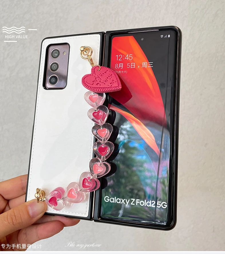 Fashion DIY Cute Love Heart Bracelet Hand Chain Leather Case For Samsung Galaxy Z FOLD 2 3 5G PU Shockproof Hard Back Cover
Fashion DIY Cute Love Heart Bracelet Hand Chain Leather Case For Samsung Galaxy Z FOLD 2 3 5G PU Shockproof Hard Back Cover