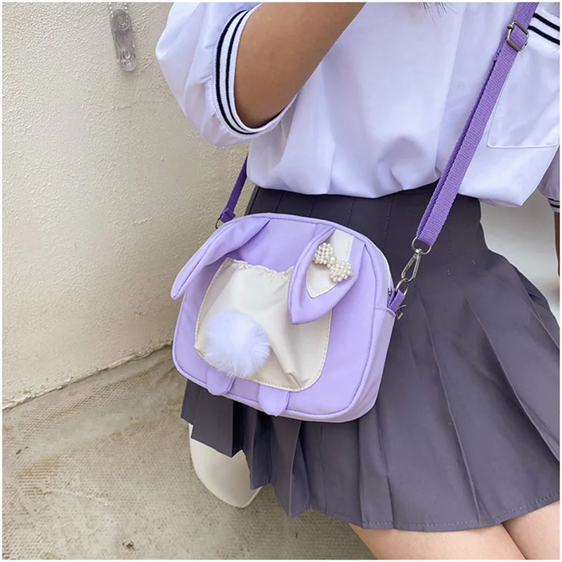 Lolita style rabbit tail canvas bag female 2021 new personality cute Girl student shoulder messenger bag
Lolita style rabbit tail canvas bag female 2021 new personality cute Girl student shoulder messenger bag