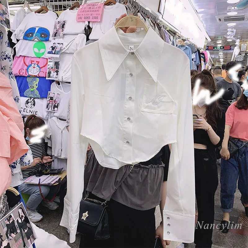 Short Lapels Drill Buckle Embroidered Shirts and Blouses Women Elegant White Top Ins Irregular Design Ladies Blusas
Short Lapels Drill Buckle Embroidered Shirts and Blouses Women Elegant White Top Ins Irregular Design Ladies Blusas