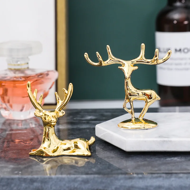 Mini Light Metal Golden Couple Deer Figurines Nordic Animal Ring Jewelry Holder Artcraft Gifts for the New Year Home Decoration 
Mini Light Metal Golden Couple Deer Figurines Nordic Animal Ring Jewelry Holder Artcraft Gifts for the New Year Home Decoration
