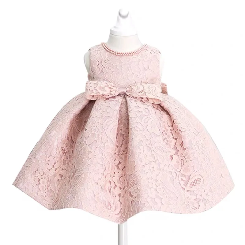 Фото Детское кружевное платье принцессы розовое с бантом и бусинами для крещения на 1