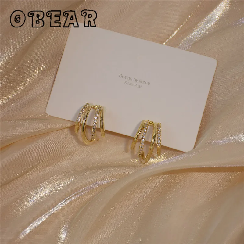 OBEAR 14k Real Gold Korean Version Simple Multi-Layer Geometric circle Inlaid Zircon Earrings Women Elegant Delicate Jewelry
OBEAR 14k Real Gold Korean Version Simple Multi-Layer Geometric circle Inlaid Zircon Earrings Women Elegant Delicate Jewelry
