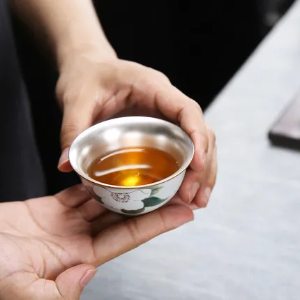 De Hua Ceramic Teacup Sterling Silver 999 Pure Hand Silver Plating Inside Tea Bowl Kung Fu Green Tea Tie Guan Yin Oolong Teaware 
De Hua Ceramic Teacup Sterling Silver 999 Pure Hand Silver Plating Inside Tea Bowl Kung Fu Green Tea Tie Guan Yin Oolong Teaware
