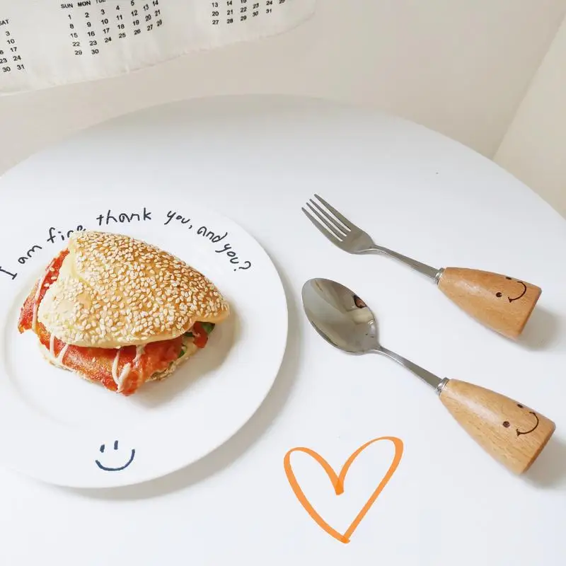 Eco Friendly Tableware Cute Stainless Steel Creative Smile Spoon and Fork Set Wooden Handle Dinnerware Set Kitchen Accessories
Eco Friendly Tableware Cute Stainless Steel Creative Smile Spoon and Fork Set Wooden Handle Dinnerware Set Kitchen Accessories