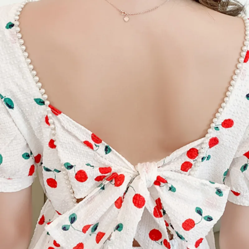 2021 Summer New Sexy Hollow Out Bow Printed Mini Dress Female Pearl Fashion Short Sleeve Slim Vintage Party Dress Vestidos Mujer 
2021 Summer New Sexy Hollow Out Bow Printed Mini Dress Female Pearl Fashion Short Sleeve Slim Vintage Party Dress Vestidos Mujer
