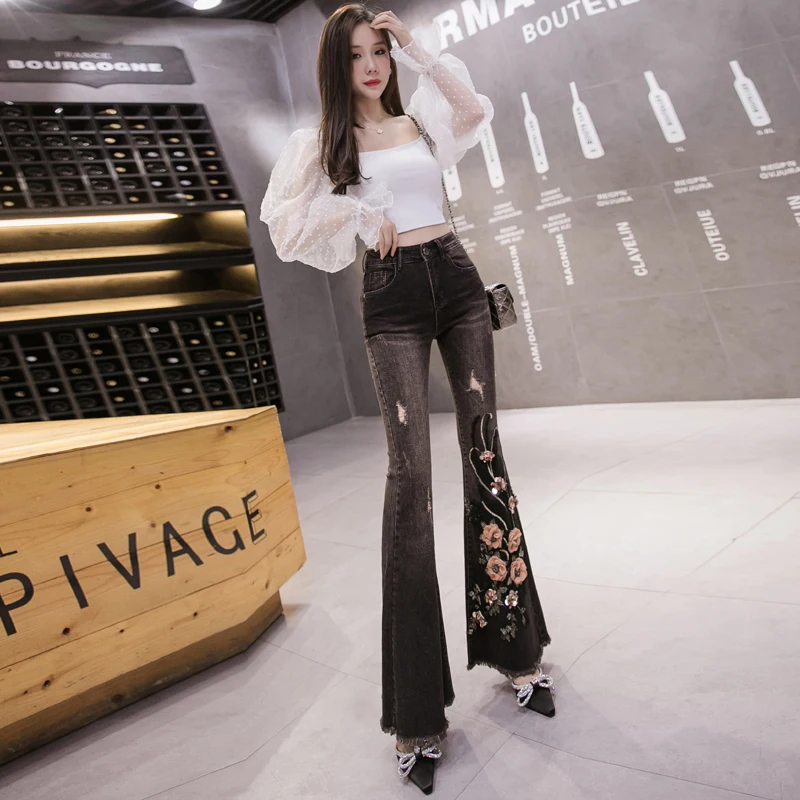 Fashionable new style slim heavy embroidery black stretch denim flared pants 
Fashionable new style slim heavy embroidery black stretch denim flared pants