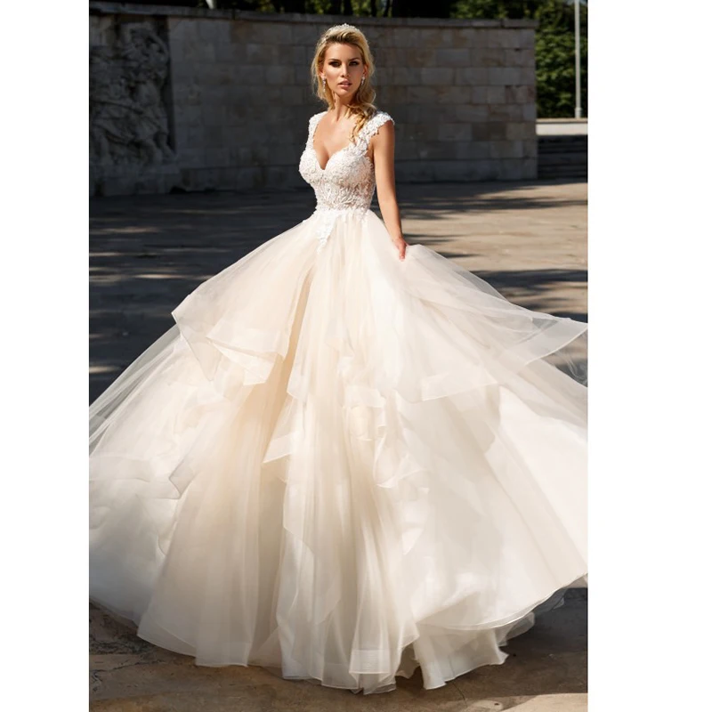 Elegant A-Line Ruffles Tiered Boho Beach Champagne Wedding Dresses Deep V neck Lace Appliques Gowns Custom Vestido De Noiva
Elegant A-Line Ruffles Tiered Boho Beach Champagne Wedding Dresses Deep V neck Lace Appliques Gowns Custom Vestido De Noiva