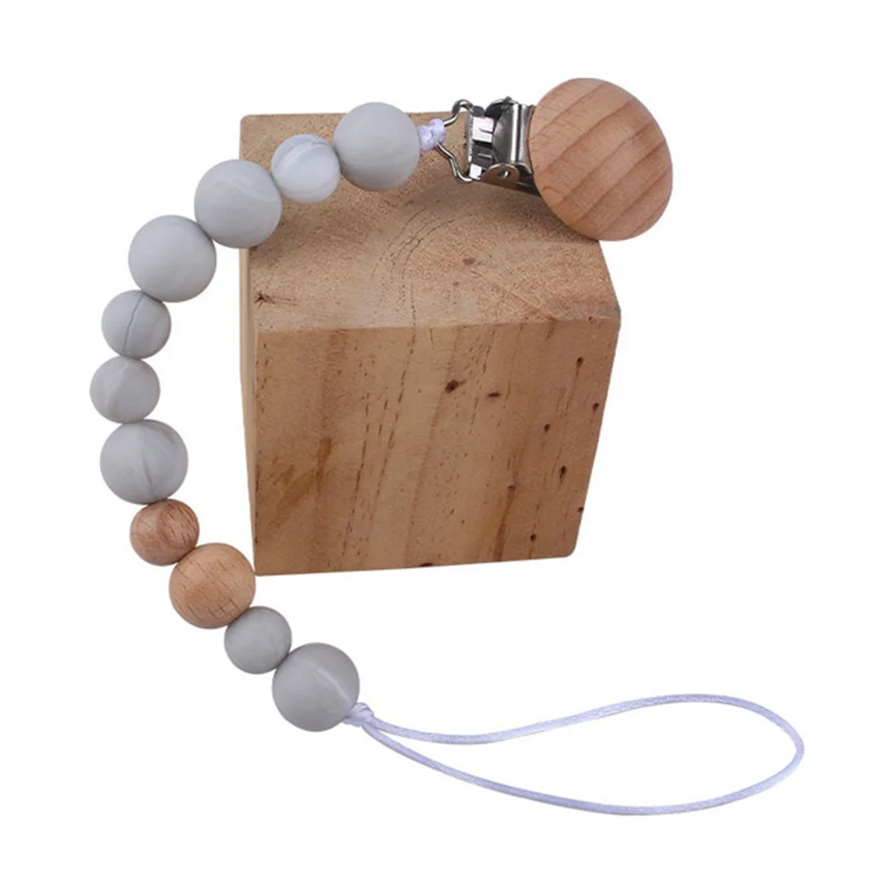 Newborn Feeding Pacifier Baby Wooden Beaded Pacifier Clip Silicone Chain Nipple Holder Baby Pacifier For Children 2021 Hot Sale
Newborn Feeding Pacifier Baby Wooden Beaded Pacifier Clip Silicone Chain Nipple Holder Baby Pacifier For Children 2021 Hot Sale